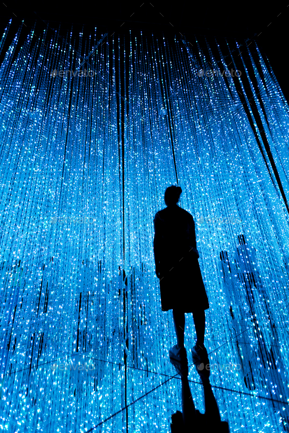 Woman and other people in illuminated virtual multiverse concept - Stock Photo - Images