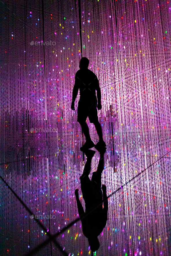 Man and other people in illuminated virtual multiverse concept - Stock Photo - Images