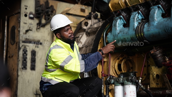 Portrait of maintenance engineer or apprentice in workshop of railway engineering facility