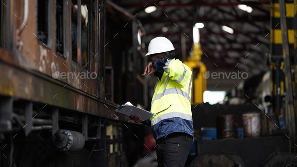 Portrait of maintenance engineer or apprentice in workshop of railway engineering facility