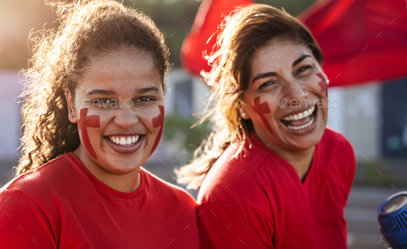 Female football fans cheering for their favorite team - Sport entertainment concept - Stock Photo - Images