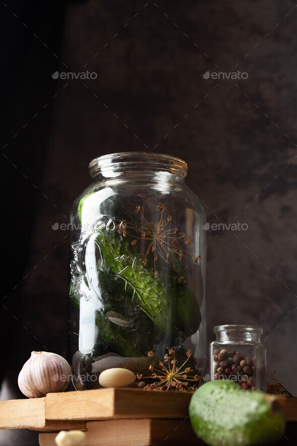 Canning process of cucumber in mason jar. Conservation and cooking Stock Photo by radio_sunnydale