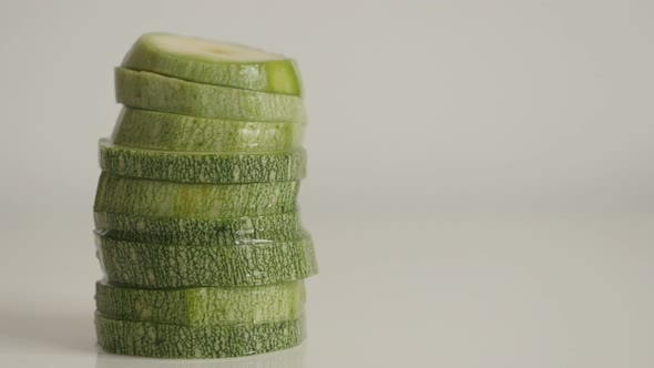 Tilting on organic zucchini  close-up 4K 2160p 30fps UltraHD tilting  footage - Green Pepo cylindric alt