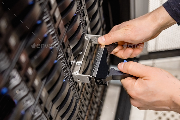 Male Technician Replacing Server Drive At Datacenter - Stock Photo - Images