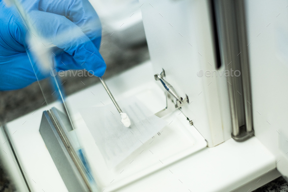 Weighing sample on the micro balance for sample  preparation, chemical analysis in laboratory. - Stock Photo - Images