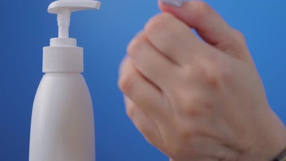 Slow Motion: Woman Squeezing Out Antiseptic Gel on Palm, Cleaning Hands: Closeup
