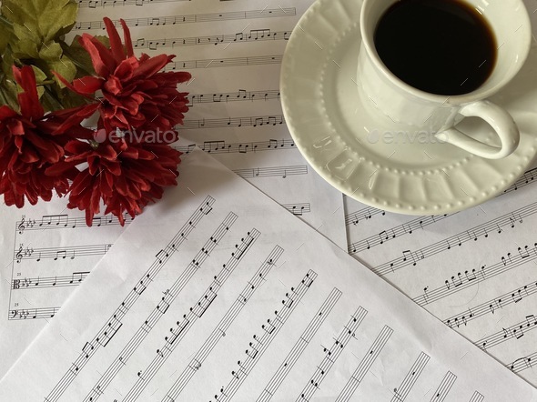 Sheet music with flowers and coffee cup