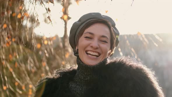 Close Up of a Gorgeous Happy Stylish Woman Smiling to the Camera alt