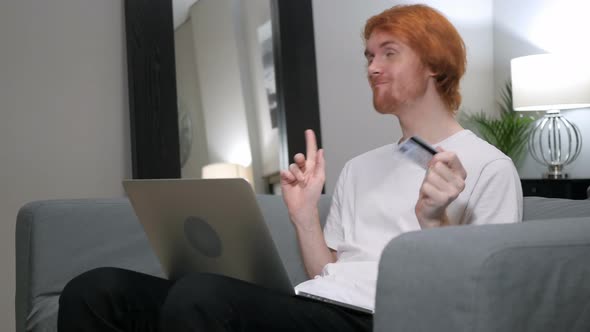 Redhead Man Excited for Successful Online Shopping alt