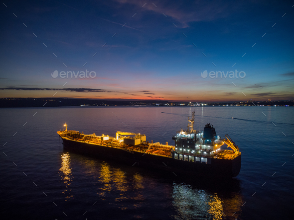 Aerial view oil ship tanker carrier oil on the sea at night