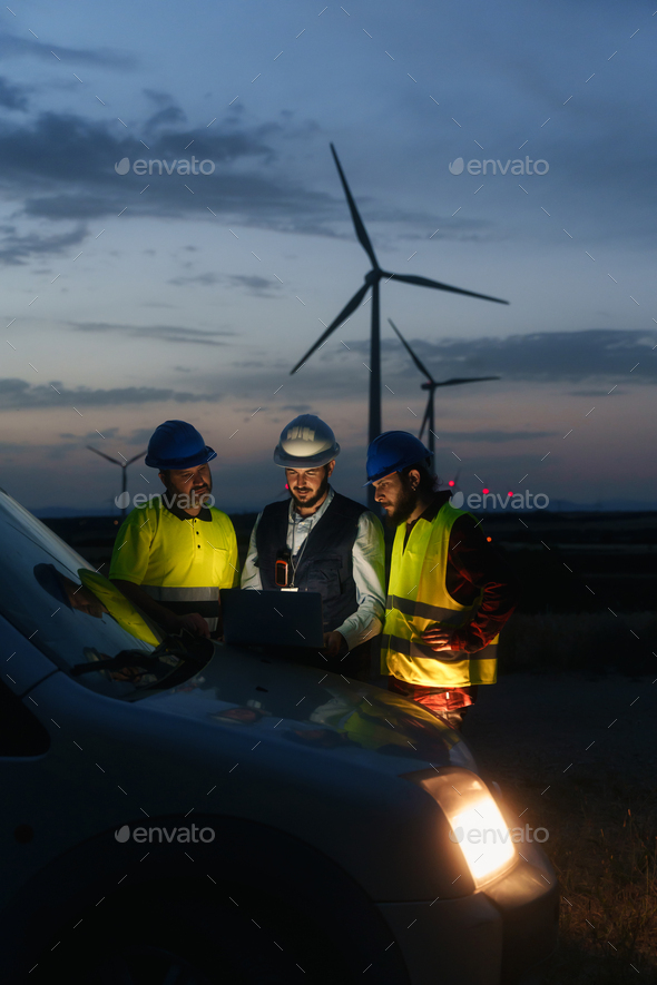 Electrical Engineer and technical specialists working on electricity wind power station