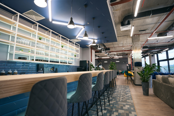 Creative zoning in a modern coworking space, stylish bar area