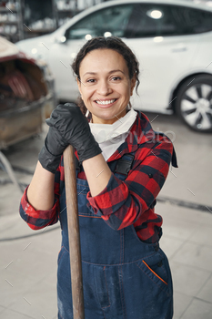 Positive delighted woman working at modern service station