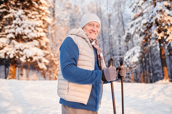Senior Man Enjoying Nordic Walk in Winter