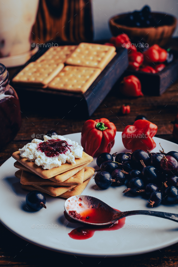 Crackers with Cream Cheese and Chili Pepper Jam Stock Photo by Seva_blsv