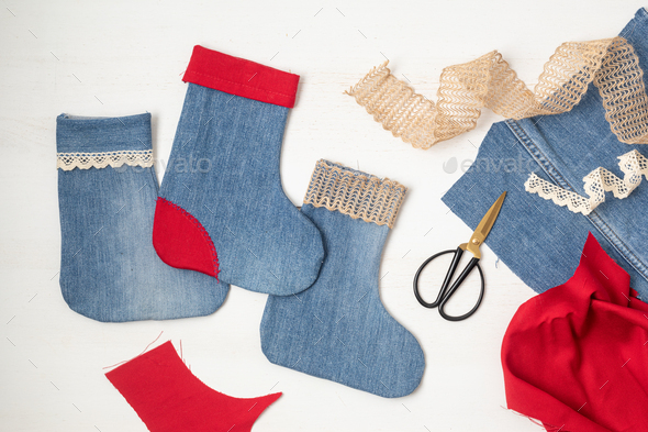 Diy project of christmas stockings made of re-purposed old jeans Stock  Photo by OksaLy