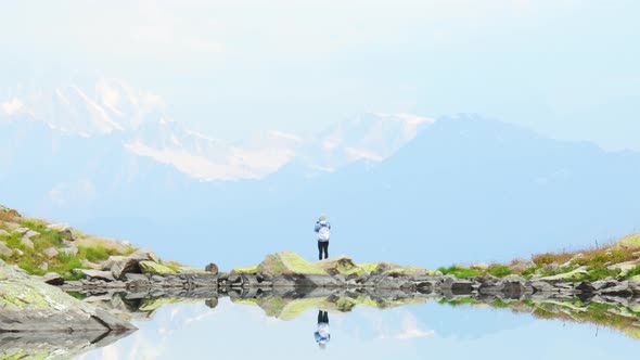 Person Take Photo Of Mountains By Udziro Lake