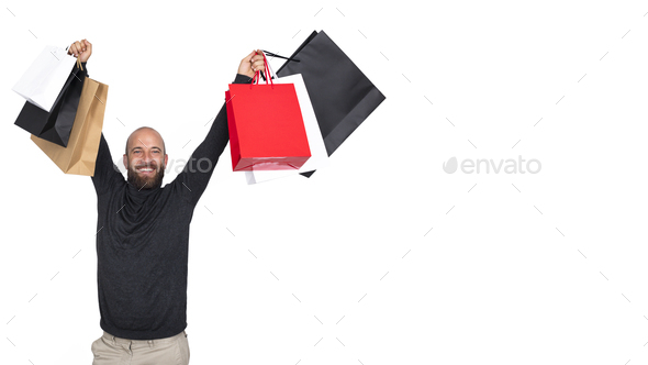 man with beard holding shopping bags.Horizontal banner.white background.Looking at camera.Copy space