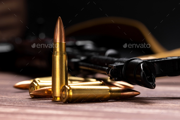Bullets against Kalashnikov assault rifle - Stock Photo - Images