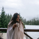Woman drinking tea on cozy balcony of a country house. - PhotoDune Item for Sale