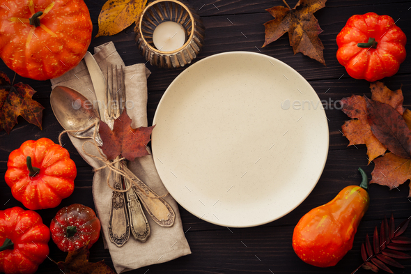 Fall table setting at dark background top view.. Stock Photo by Nadianb