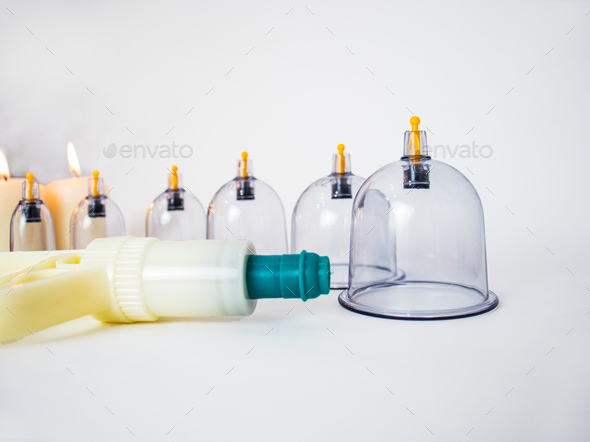 equipment for vacuum cupping massage - cupping pump and a set of cups for vacuum massage and candles