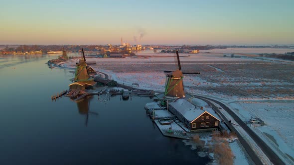 Wooden Wind Mill at the Zaanse Schans Windmill Village During Winter with Snowy Landscape Snow alt