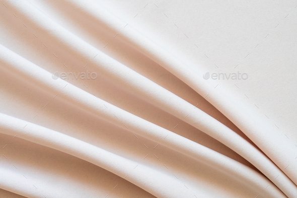 Abstract beige cloth texture background with folds. Copy space