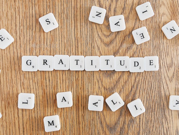 Gratitude” written with scrabble tiles Stock Photo by alexandrazaza