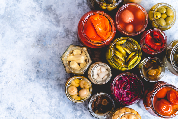 Cucumber, pepper, tomatoes, mushrooms pickling and canning into glass jars. Ingredients for - Stock Photo - Images