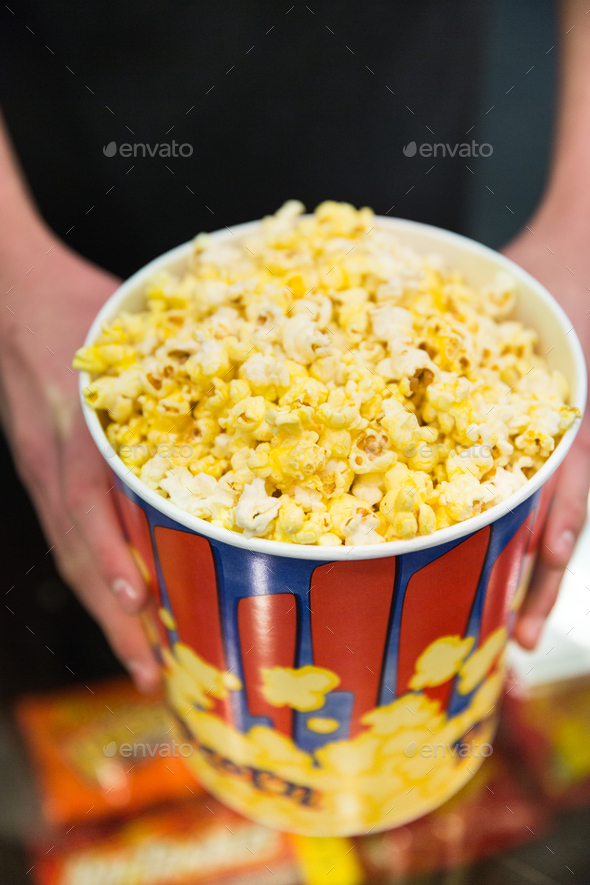 Popcorn at a movie theater concession stand Stock Photo by heatherdeffense