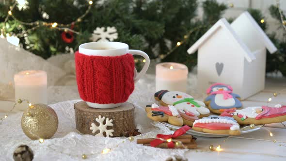 Christmas, New Year Decoration with Gingerbreads and Cup of Coffee on White Cozy Background