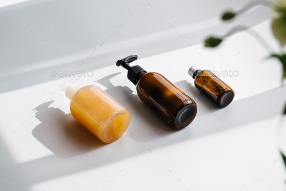 Beauty products, organic spa cosmetics, skin and body care, brown glass bottles.