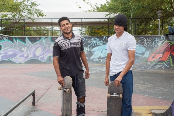 Young skateboarders in a skateboard park.
