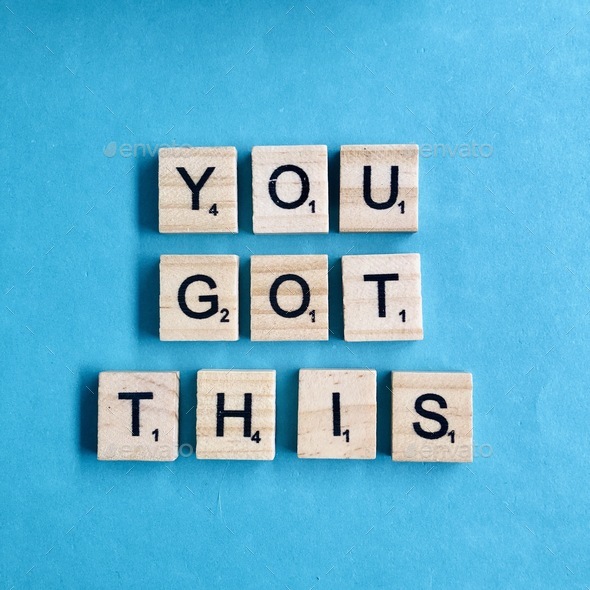 You got this written in wooden scrabble tiles on plain blue bright bold background