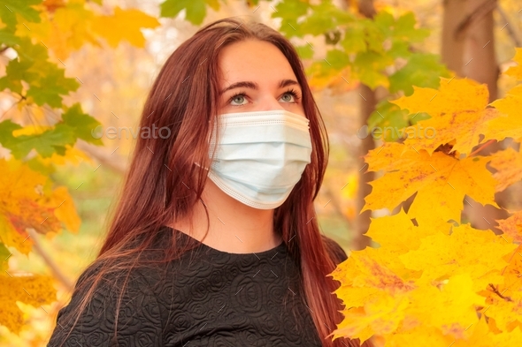 Teenage girl wearing face mask during coronavirus outbreak. Virus spread flu prevention carantine.