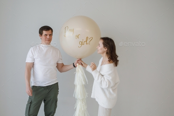 Gender reveal concept. Man and woman expecting baby guessing gender. - Stock Photo - Images