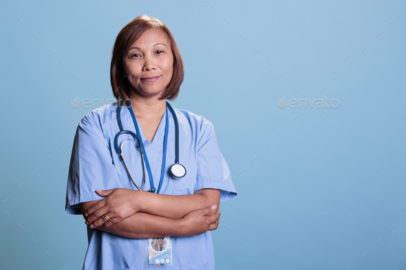 Successful physician assistant with stethoscope waiting to attend visit checkup