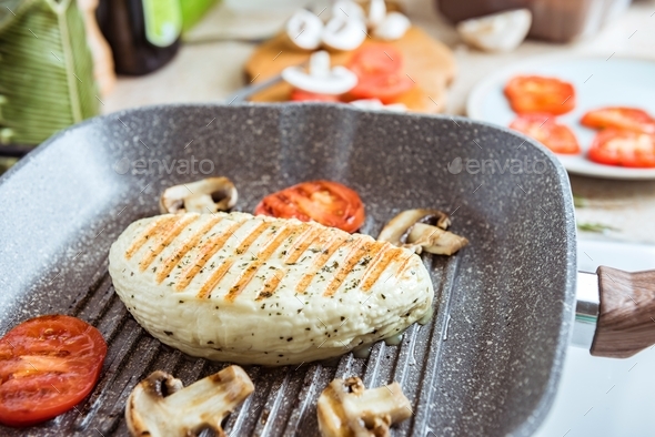 Cyprus fried halloumi cheese with red tomatoes and champignons ... Cyprus fried halloumi cheese with red tomatoes and champignons ...