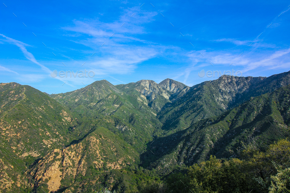 Mountains of the Los Angeles Forest. Green hills under blue sky.