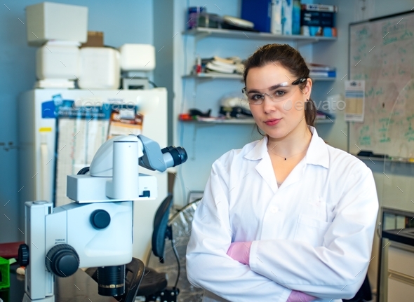 Confident woman researcher in biomedical research laboratory