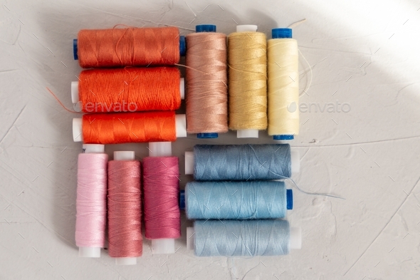 Colourful cotton threads flat lay view