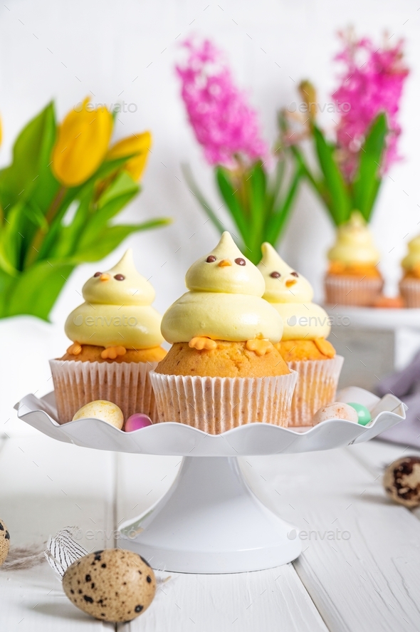 Easter cupcakes in the shape of chickens with cream. Easter food ...