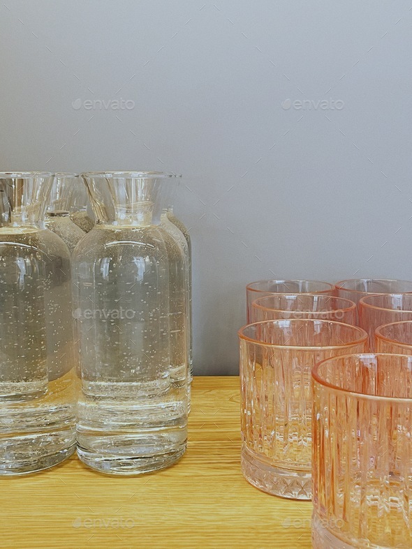 Drinking water. Water is life. Bottles of water and glasses at the cafe. Dishes.