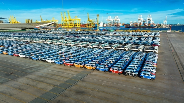 Aerial view a lot of new car for import and export shipping by ship , Smart dealership at car depot,