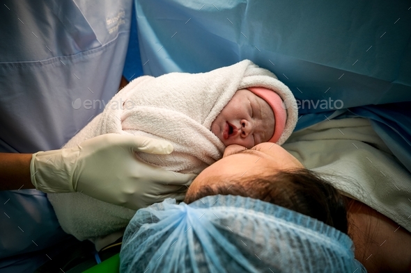 Love at First Sight of mom and her newborn in cesarean section.