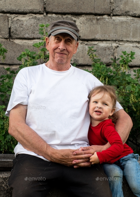 Grandpa And His Babe Grandbabe Are Sitting Outside In The Summer Stock Photo By JuliaZemskaia