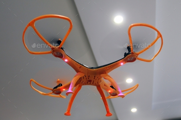 The quadcopter flies indoors. Modern developments and devices.