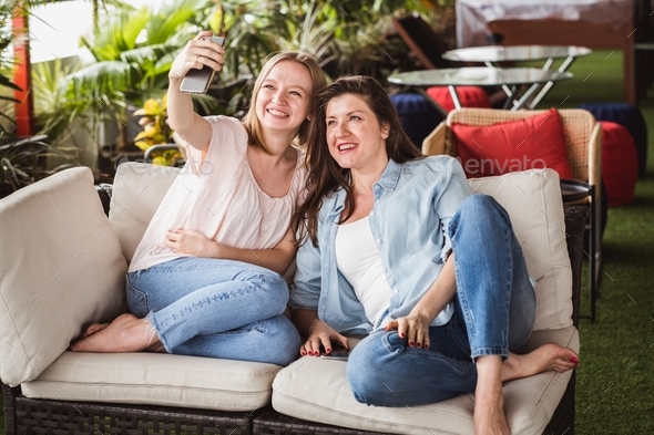 Two girls take selfie for social networking sites