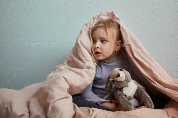 Little scared girl hiding under blanket aggression, war, protection, psychology, childhood, violence
